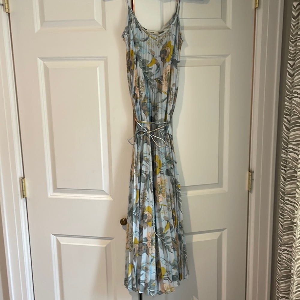 Vince.  Spaghetti straps on this beautiful, worn once, pleated, floral dress.